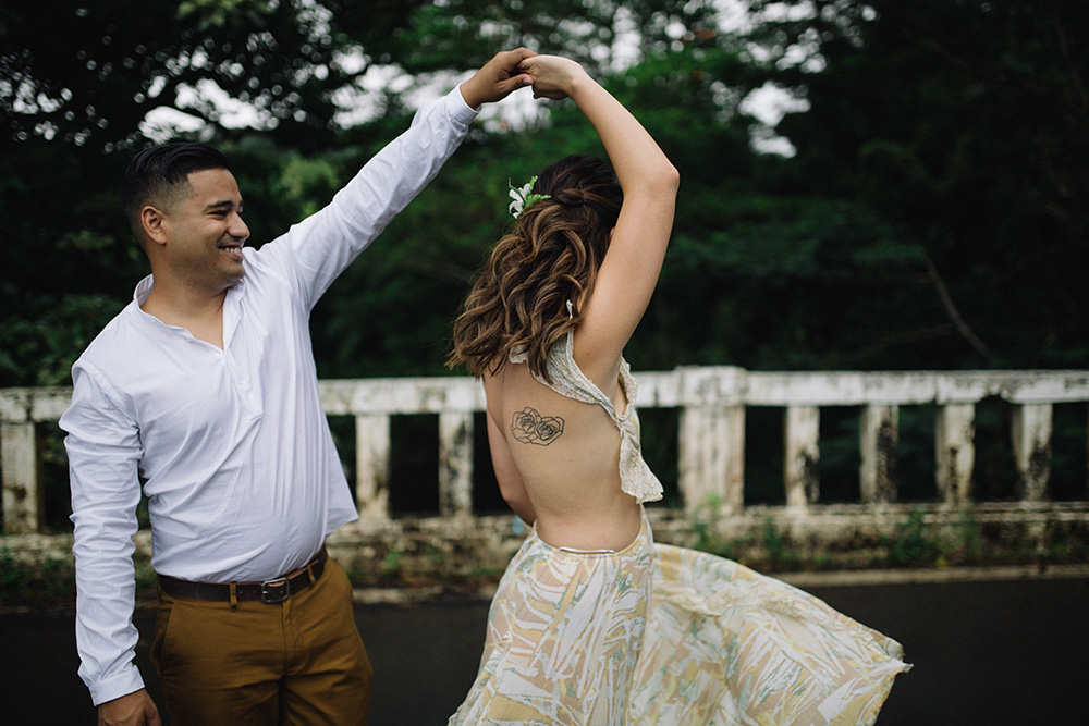 dancing on the road to hana in maui, hawaii for their engagement photo session. 