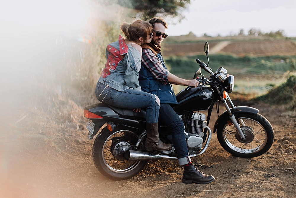 motorcycle couple during couples photography session in maui, hawaii.