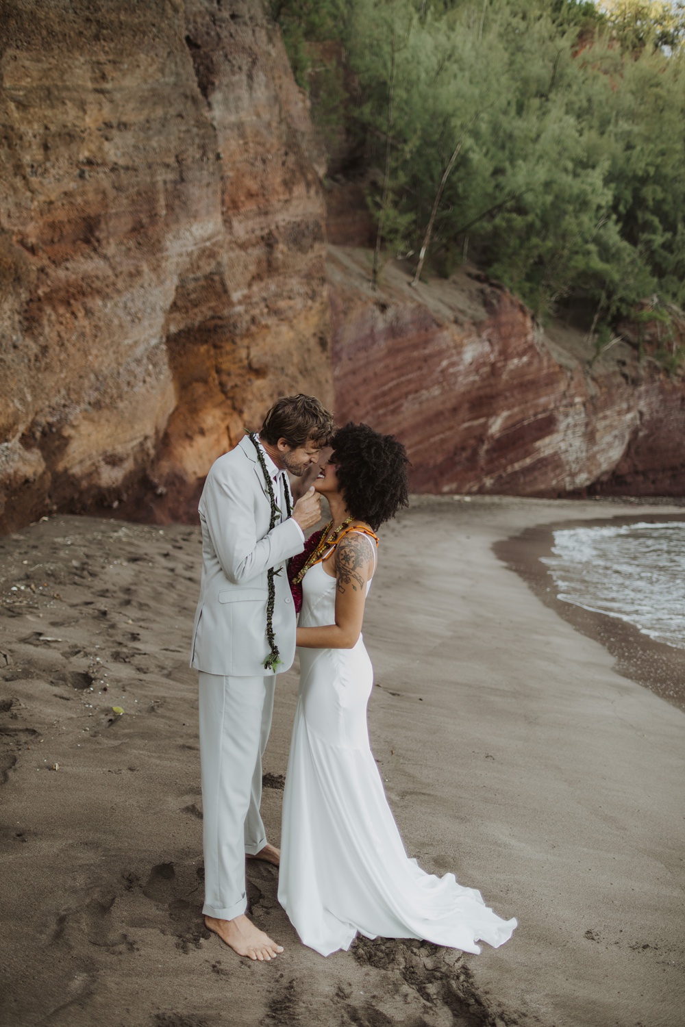 couple at koki beach for hana, hawaii elopement