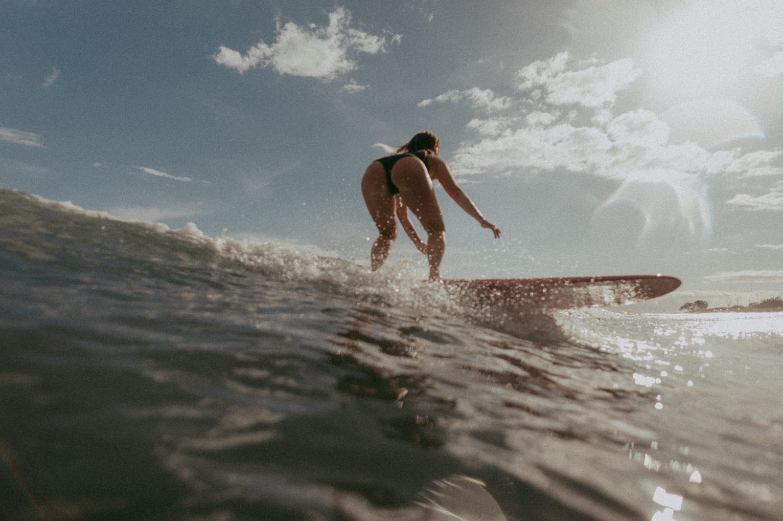 girl surfing maui