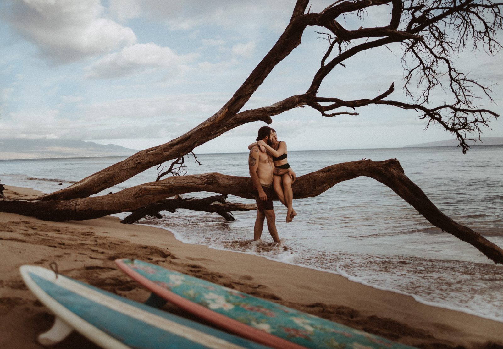couples photography session with surfboards