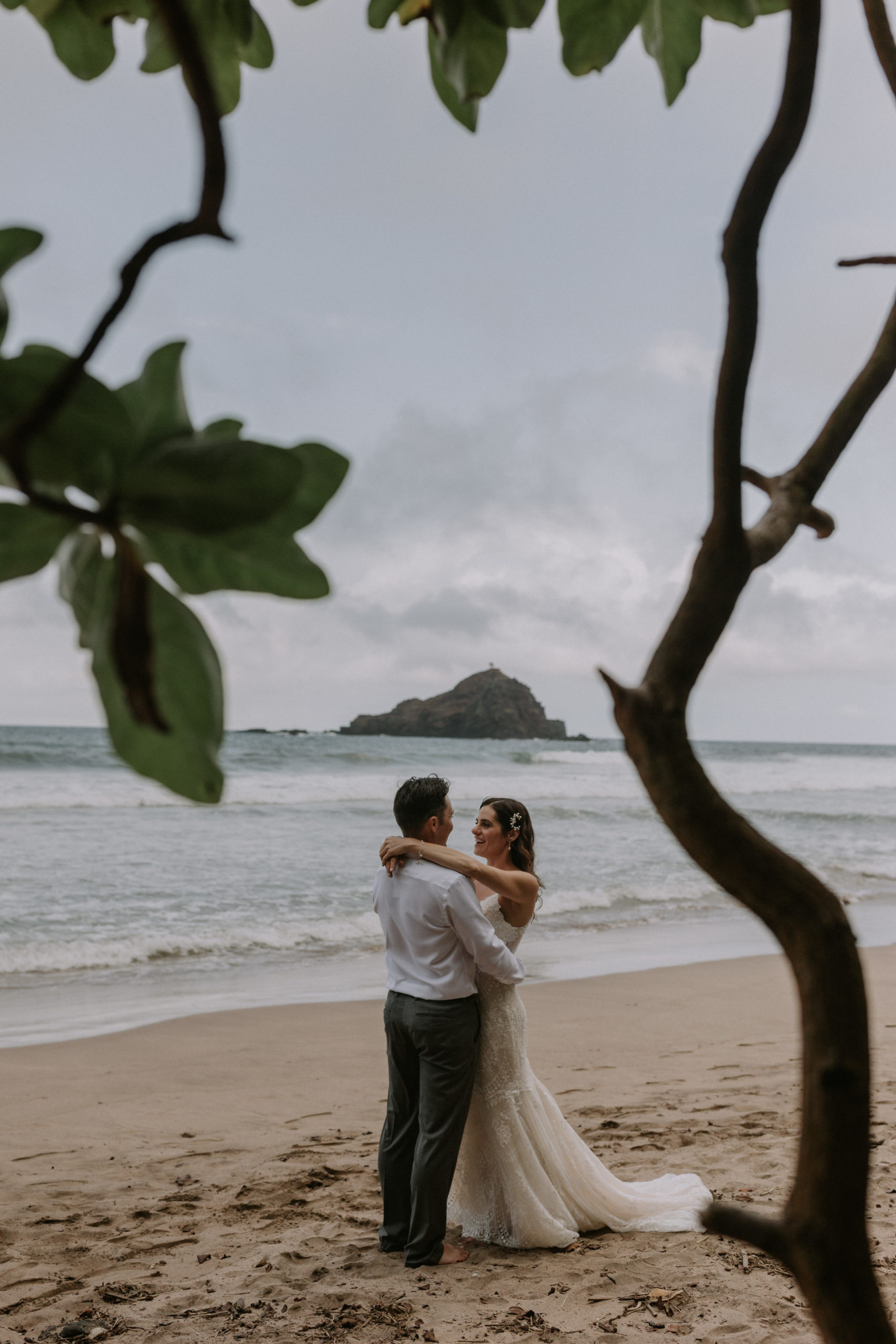 couple at Koki Beach for a first look in hana Maui